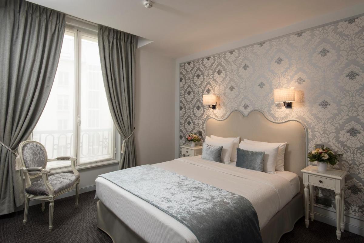 Un ou plusieurs lits dans un hébergement de l'établissement Hôtel Saint-Pétersbourg Opéra & Spa
