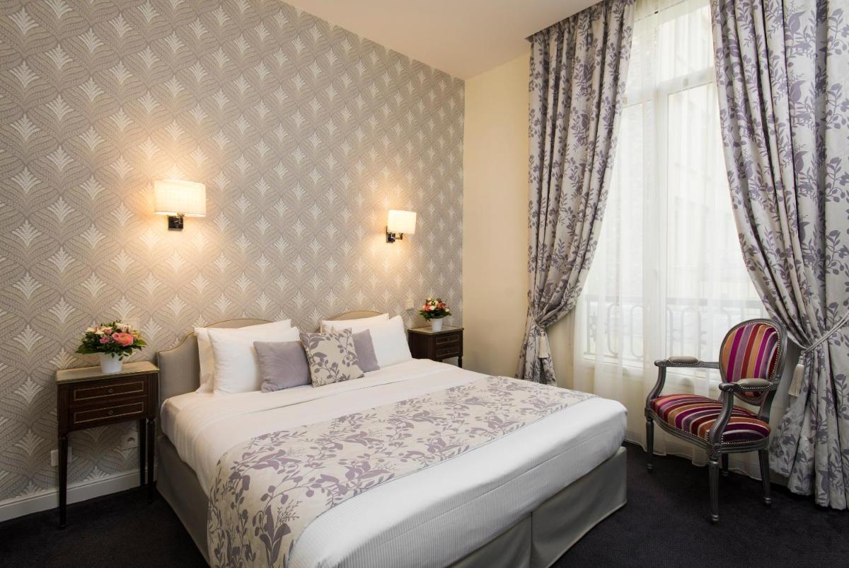 Un ou plusieurs lits dans un hébergement de l'établissement Hôtel Saint-Pétersbourg Opéra & Spa