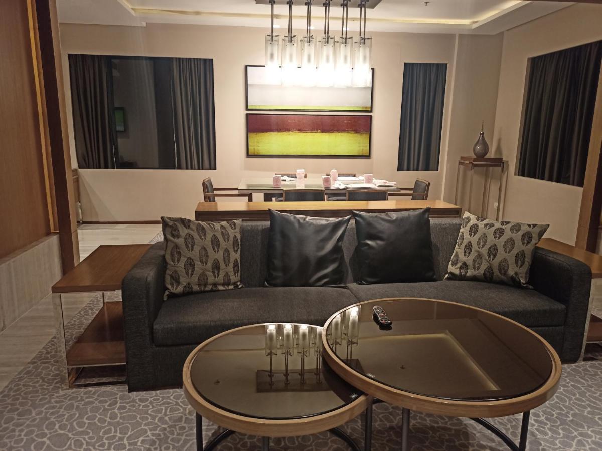 a living room with a couch and a table at Welcomhotel by ITC Hotels, Richmond Road, Bengaluru in Bengaluru