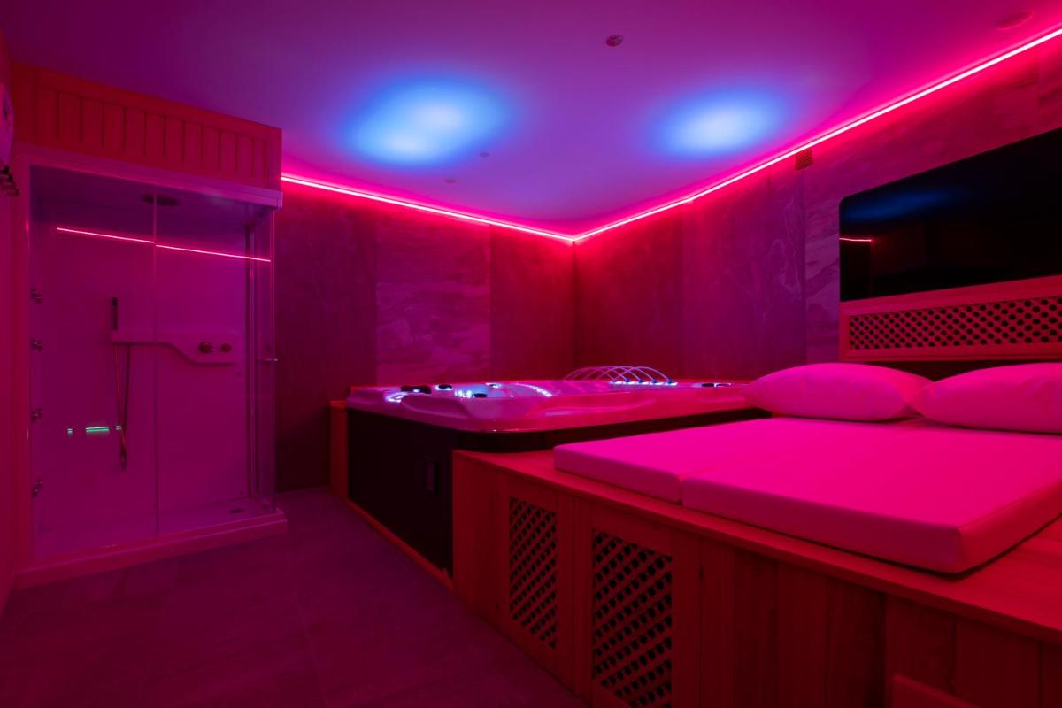 Cama o camas de una habitación en Hotel 1877 Sensaciones & SPA ADULTS ONLY