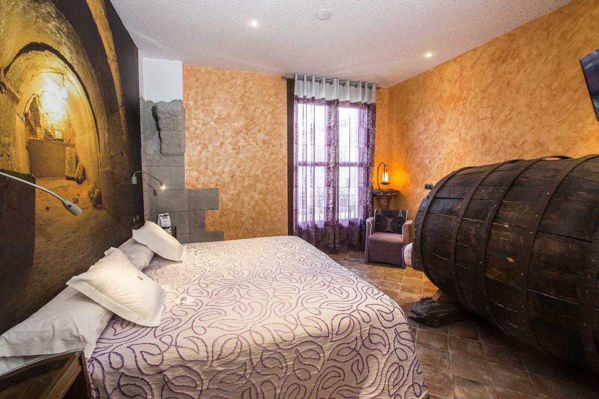 Cama o camas de una habitación en Hotel SPA El Lagar de Isilla