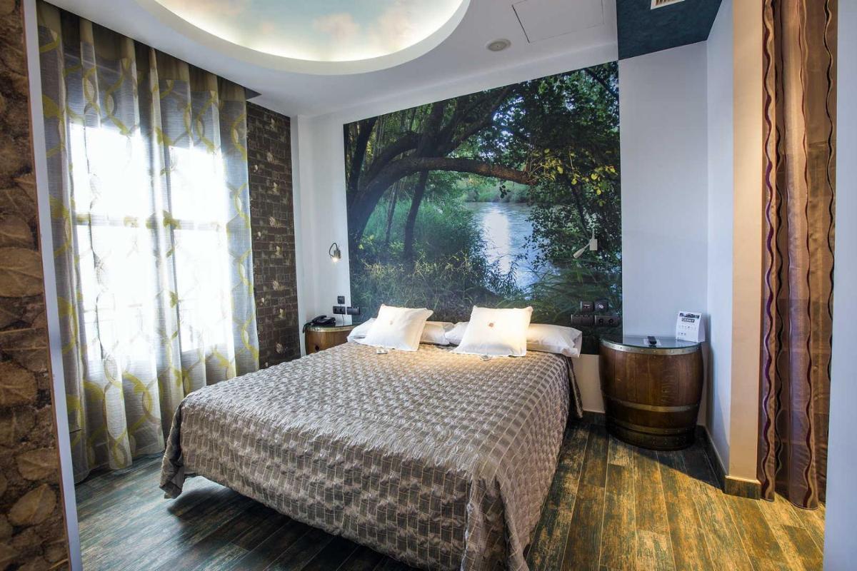 Cama o camas de una habitación en Hotel SPA El Lagar de Isilla