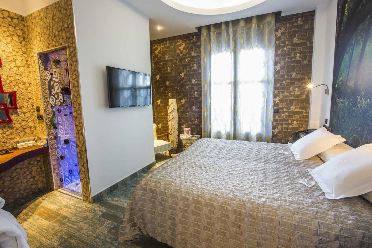 Cama o camas de una habitación en Hotel SPA El Lagar de Isilla