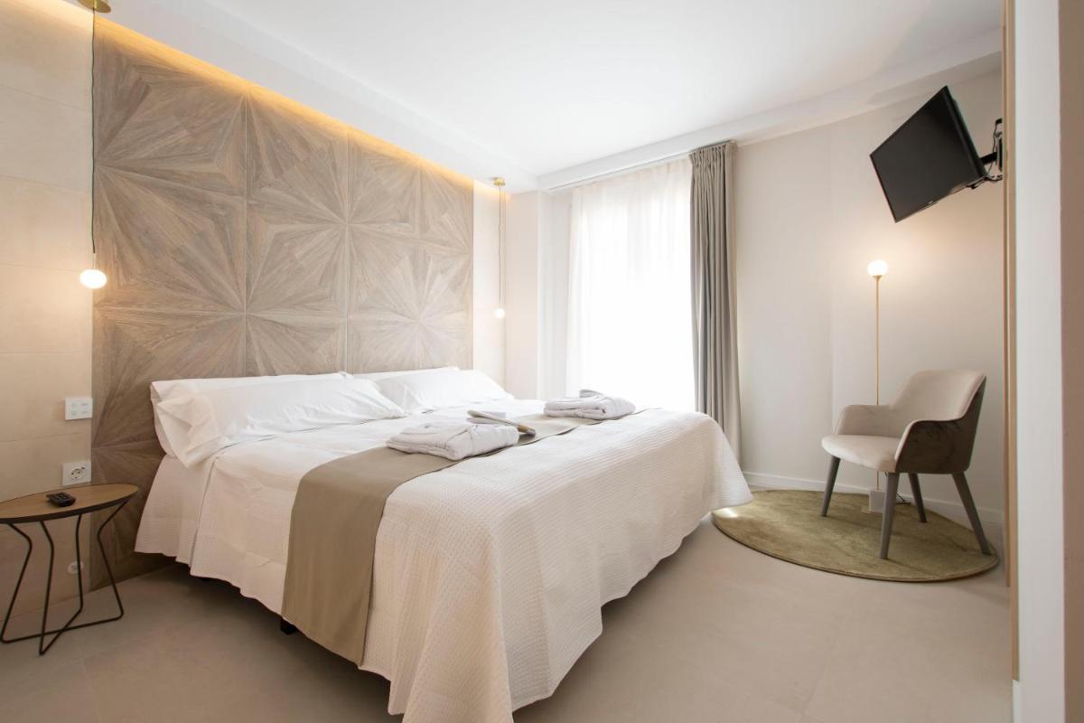 Cama o camas de una habitación en Hotel 1877 Sensaciones & SPA ADULTS ONLY