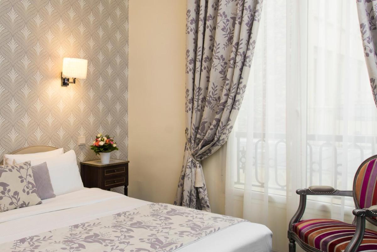 Un ou plusieurs lits dans un hébergement de l'établissement Hôtel Saint-Pétersbourg Opéra & Spa