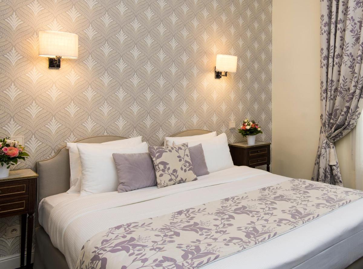 Un ou plusieurs lits dans un hébergement de l'établissement Hôtel Saint-Pétersbourg Opéra & Spa