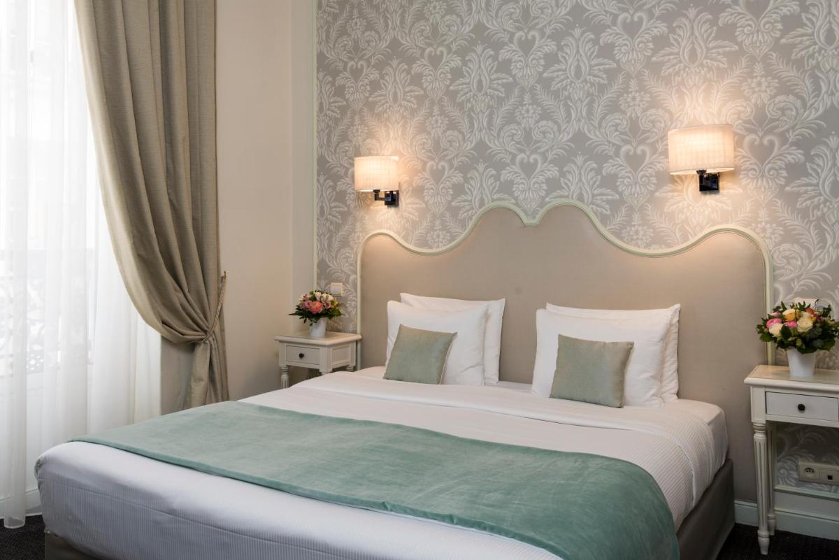 Un ou plusieurs lits dans un hébergement de l'établissement Hôtel Saint-Pétersbourg Opéra & Spa