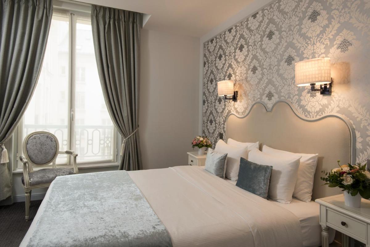 Un ou plusieurs lits dans un hébergement de l'établissement Hôtel Saint-Pétersbourg Opéra & Spa