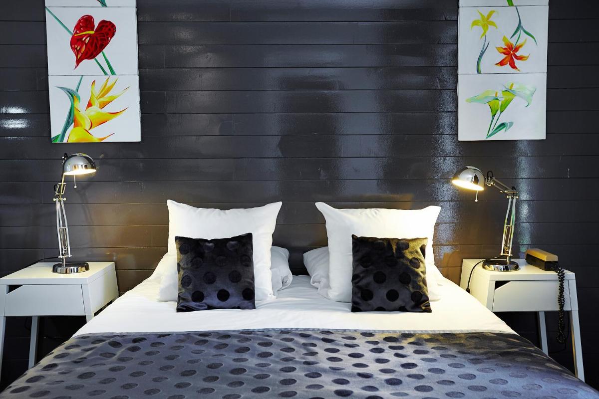 Un ou plusieurs lits dans un hébergement de l'établissement Carnac Lodge Hotel & Spa