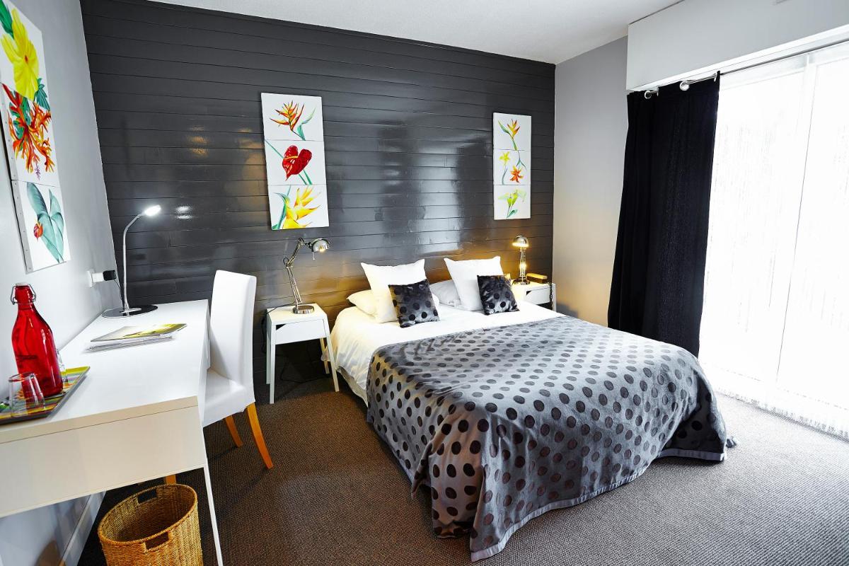 Un ou plusieurs lits dans un hébergement de l'établissement Carnac Lodge Hotel & Spa