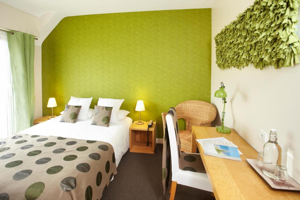 Un ou plusieurs lits dans un hébergement de l'établissement Carnac Lodge Hotel & Spa