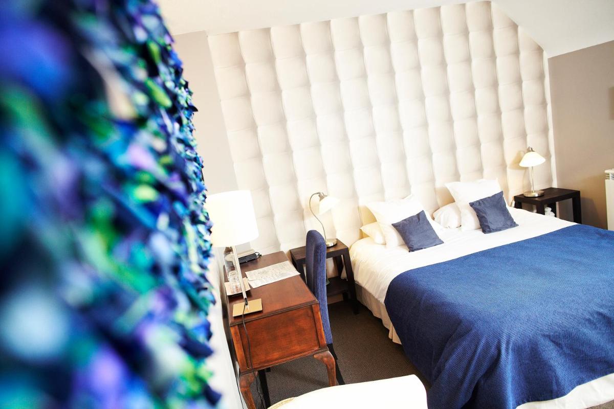 Un ou plusieurs lits dans un hébergement de l'établissement Carnac Lodge Hotel & Spa
