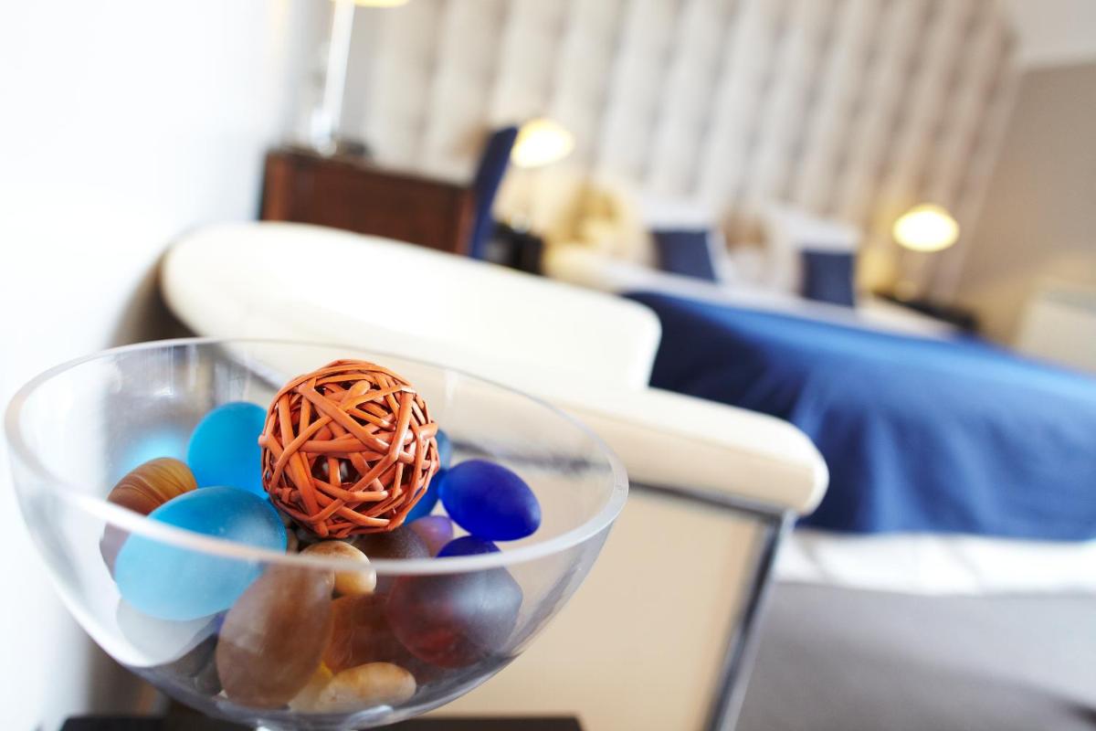 Un ou plusieurs lits dans un hébergement de l'établissement Carnac Lodge Hotel & Spa