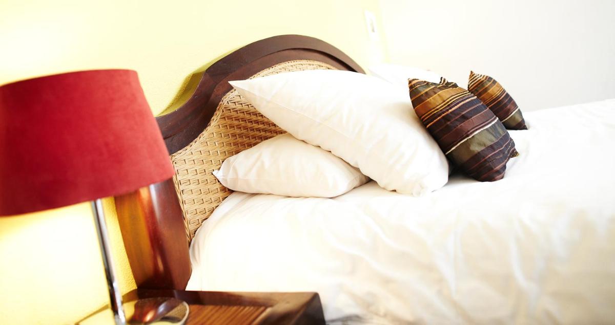Un ou plusieurs lits dans un hébergement de l'établissement Carnac Lodge Hotel & Spa