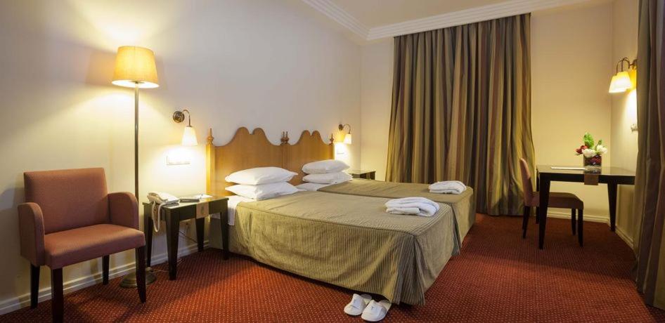 Uma cama ou camas num quarto em Hotel Termas da Curia