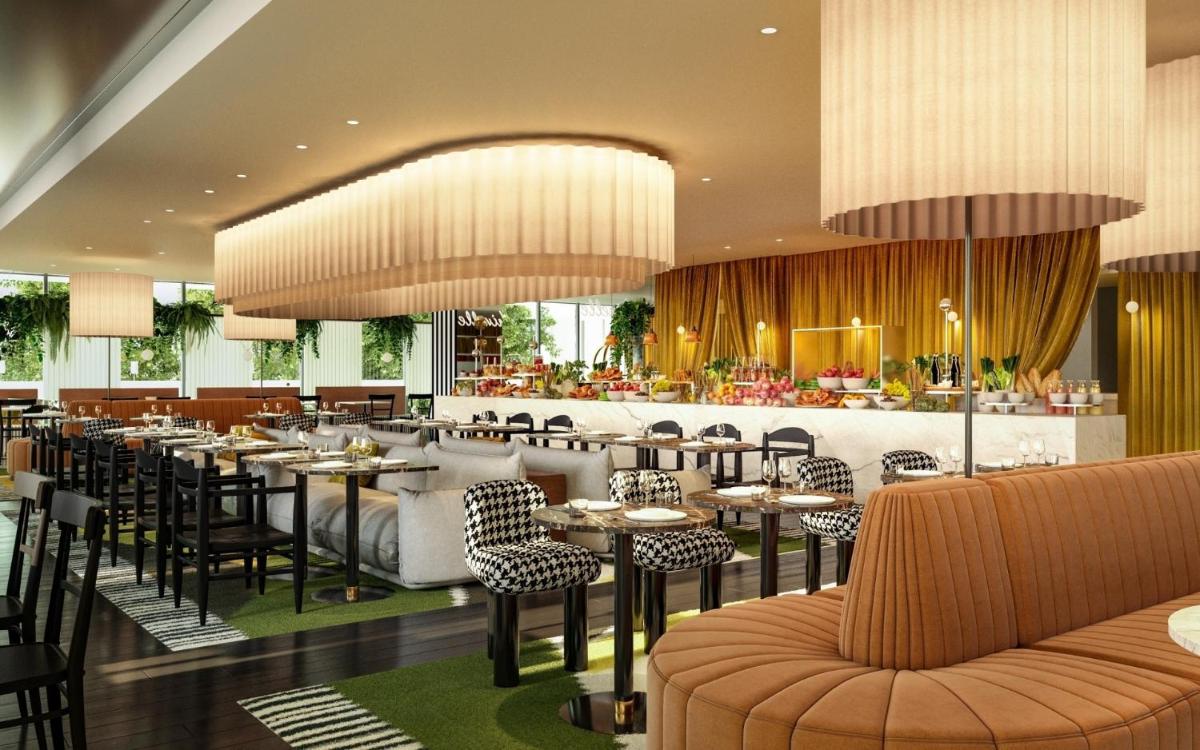 un restaurant avec des tables et des chaises et un bar dans l'établissement YOOMA Urban Lodge Tour Eiffel, à Paris