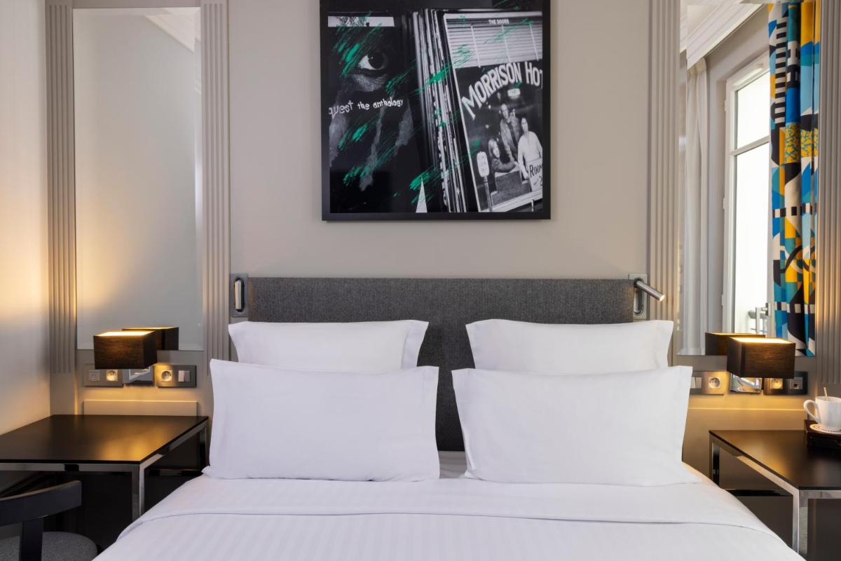 Un ou plusieurs lits dans un hébergement de l'établissement Les Matins de Paris & Spa