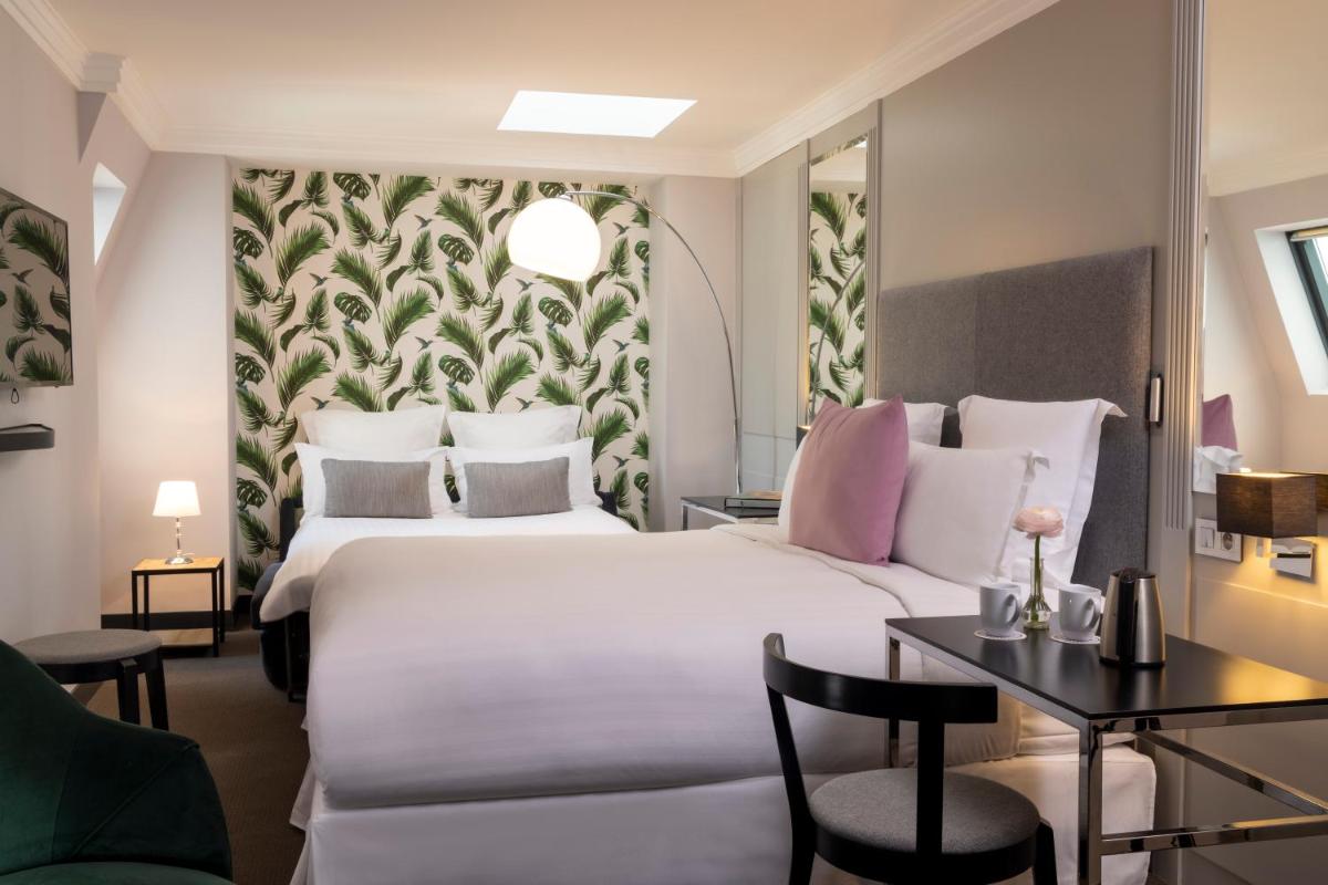Un ou plusieurs lits dans un hébergement de l'établissement Les Matins de Paris & Spa