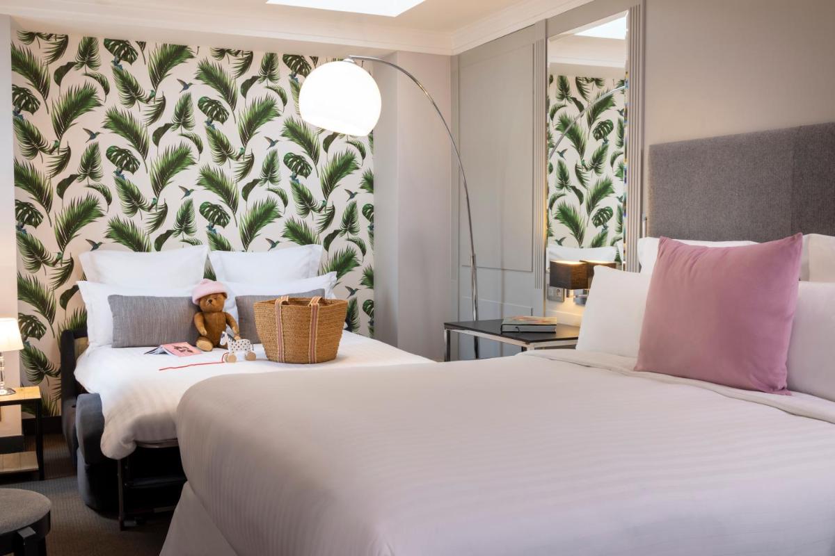 Un ou plusieurs lits dans un hébergement de l'établissement Les Matins de Paris & Spa