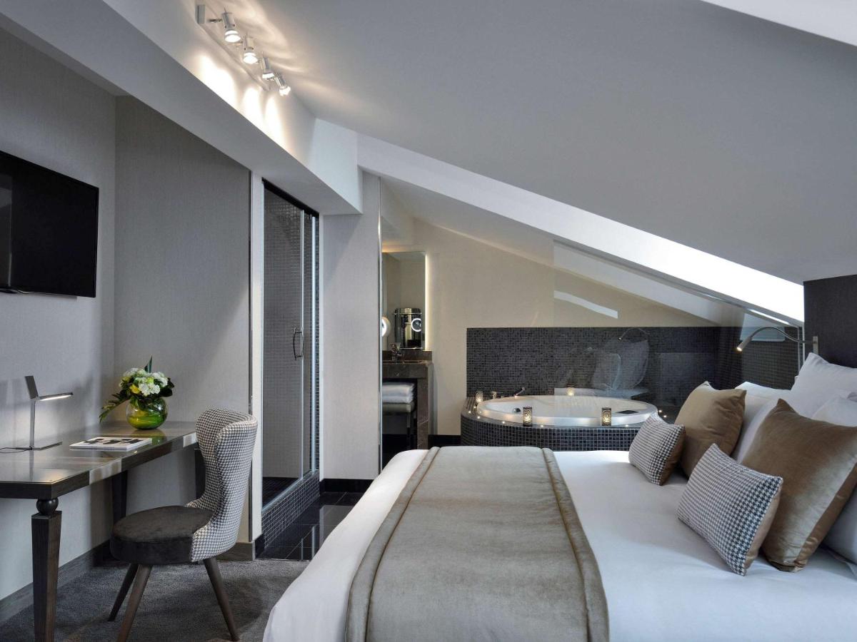 Un ou plusieurs lits dans un hébergement de l'établissement La Cour des Consuls Hotel & Spa Toulouse - MGallery Collection