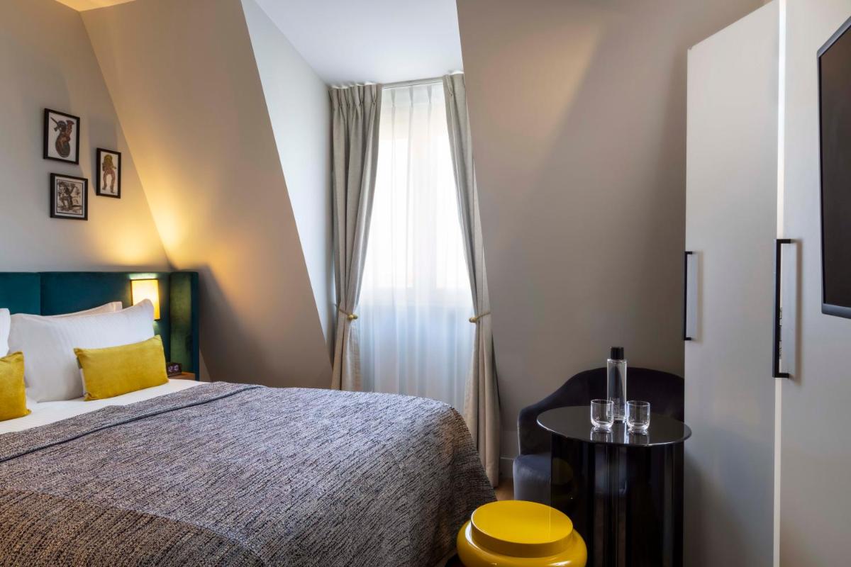 Un ou plusieurs lits dans un hébergement de l'établissement Hotel Le 37 Bis