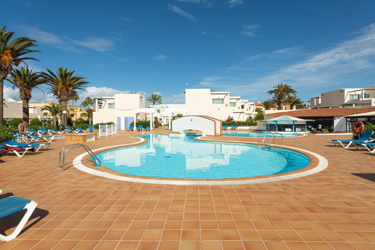 HomeforGuest Apartamento con terraza y piscina en Corralejo - Housity