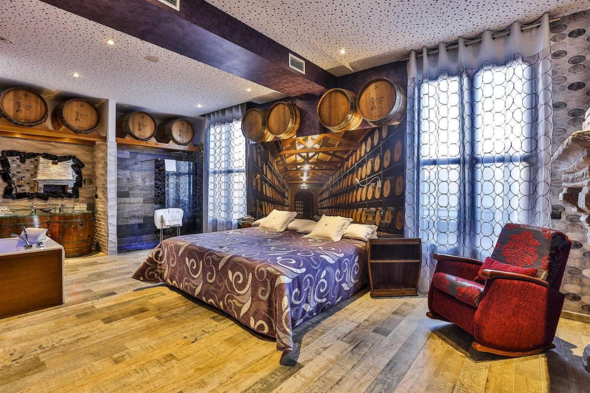Cama o camas de una habitación en Hotel SPA El Lagar de Isilla