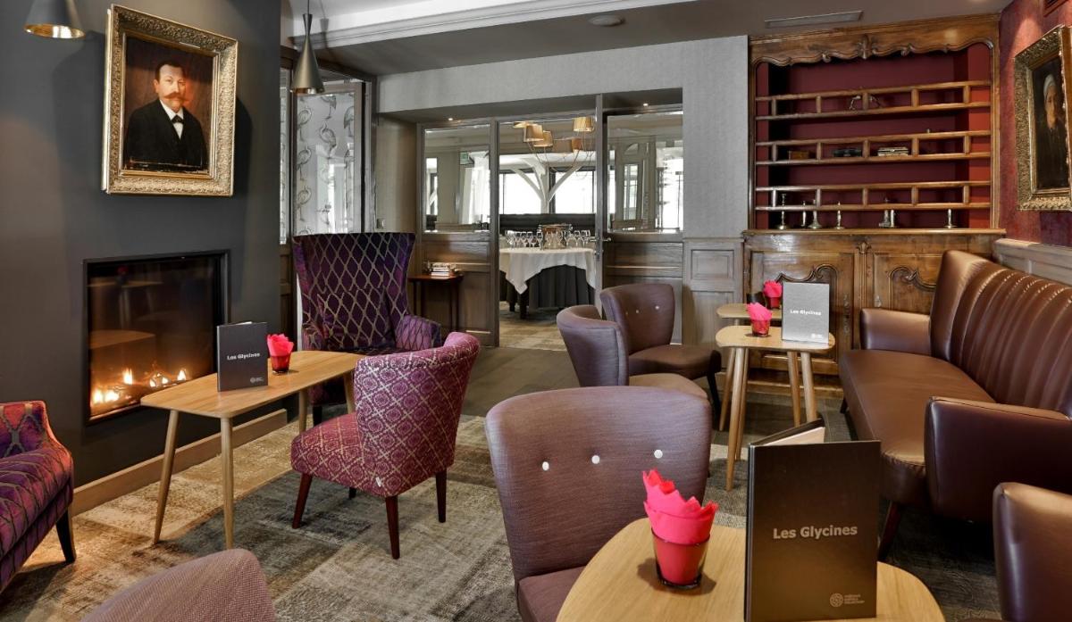 Coin salon dans l'établissement Les Glycines - Hôtel & Spa - Teritoria