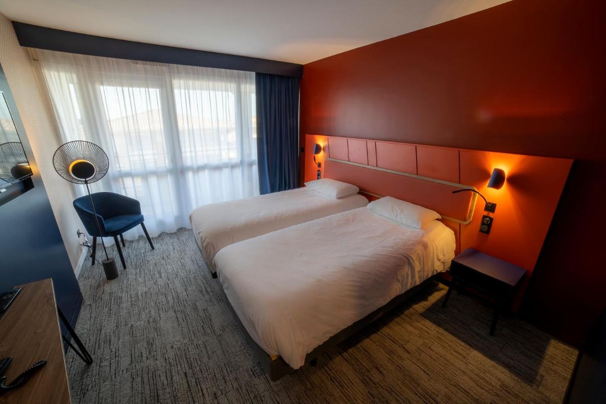 Un ou plusieurs lits dans un hébergement de l'établissement Mercure Thalasso & Spa Port Fréjus