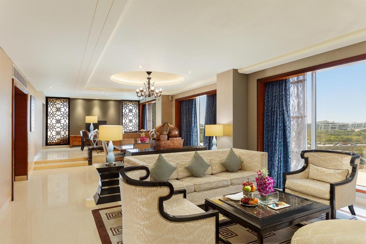 a living room with a couch and a table at Crowne Plaza Today Gurugram by IHG in Gurgaon