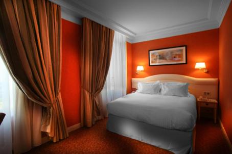 Un ou plusieurs lits dans un hébergement de l'établissement Hôtel Princesse Flore