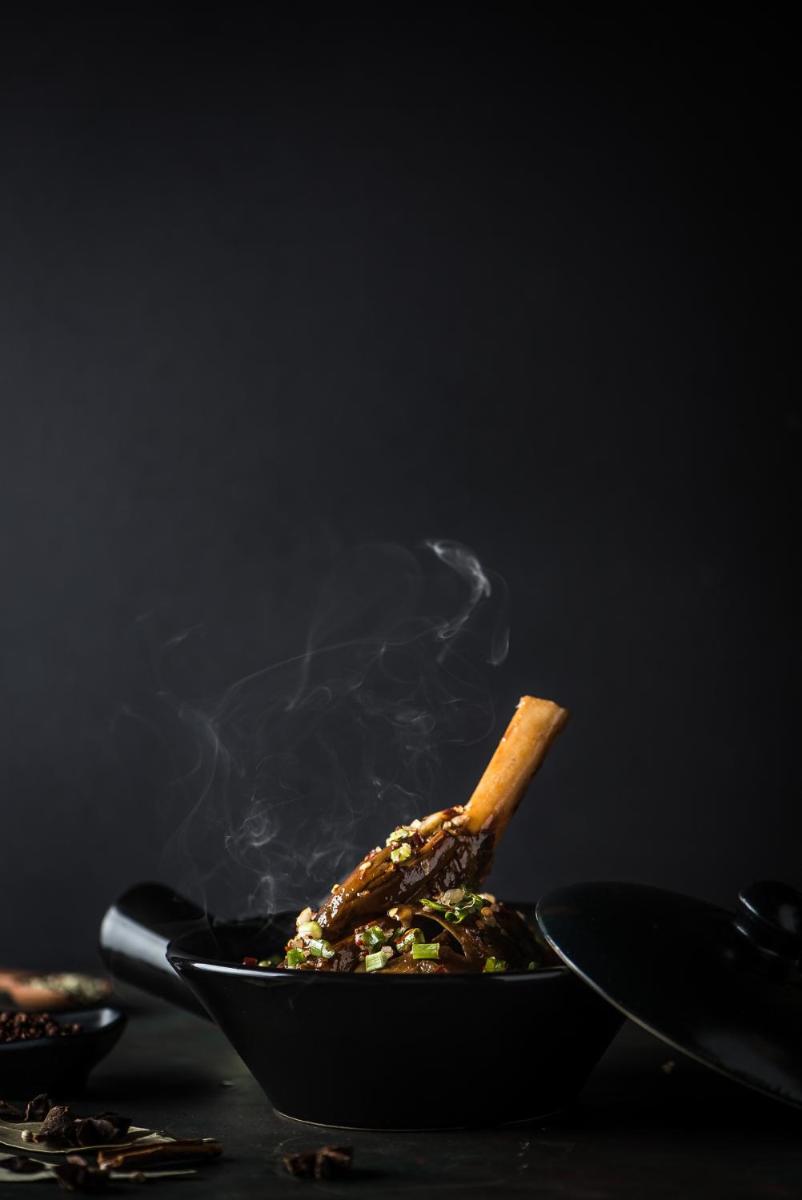 a stir fry with a stick in a frying pan at Park Hyatt Hotel and Residences, Hyderabad in Hyderabad
