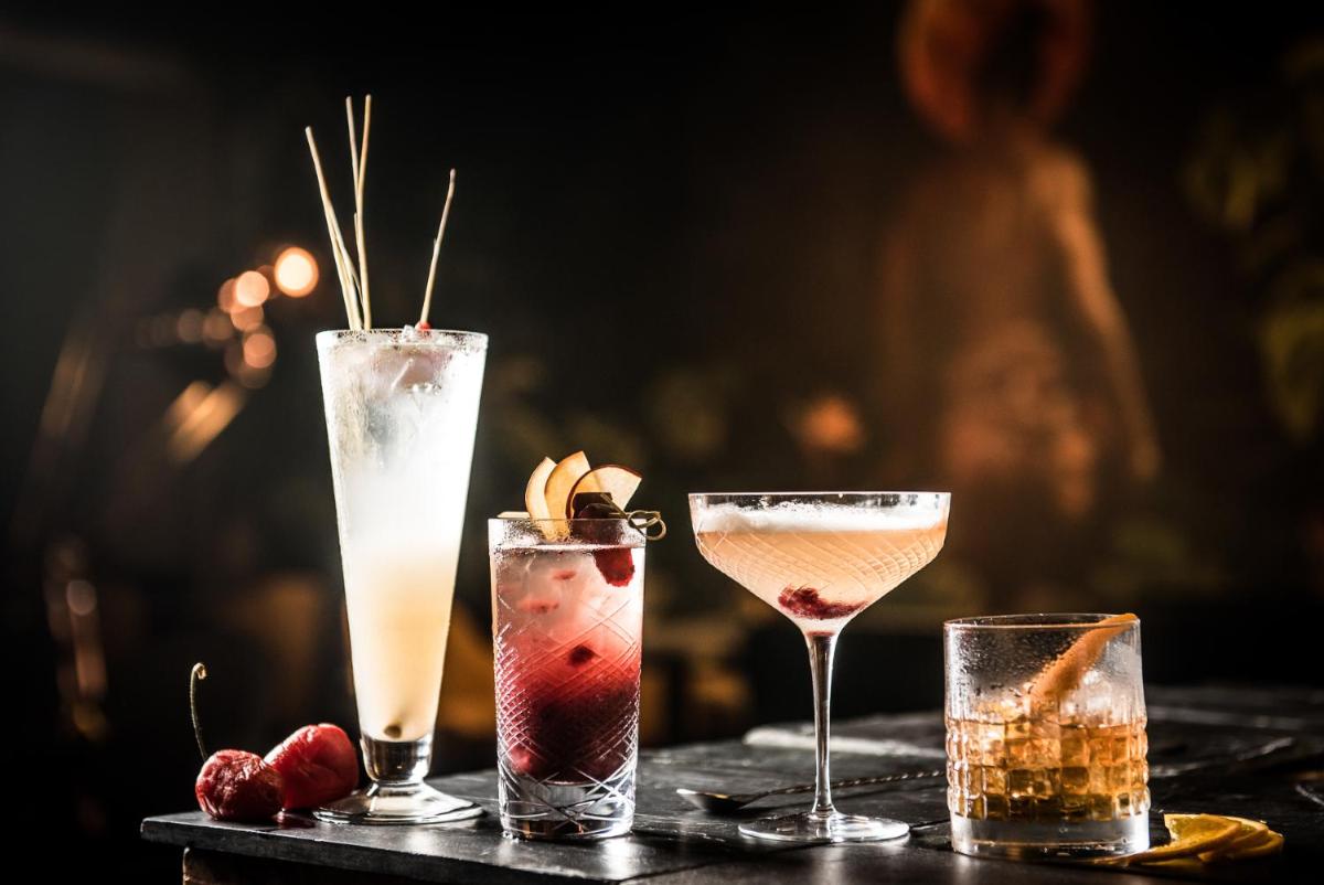 a group of three cocktails on a table at Park Hyatt Hotel and Residences, Hyderabad in Hyderabad