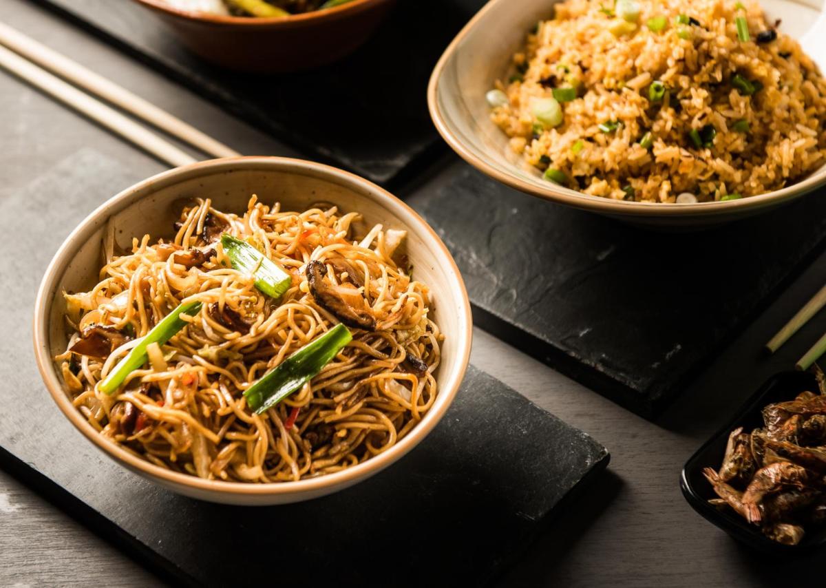 three bowls of noodles and rice on a table at Park Hyatt Hotel and Residences, Hyderabad in Hyderabad