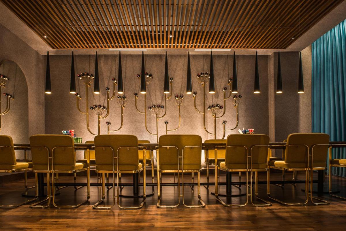 a conference room with a table and chairs at Park Hyatt Hotel and Residences, Hyderabad in Hyderabad