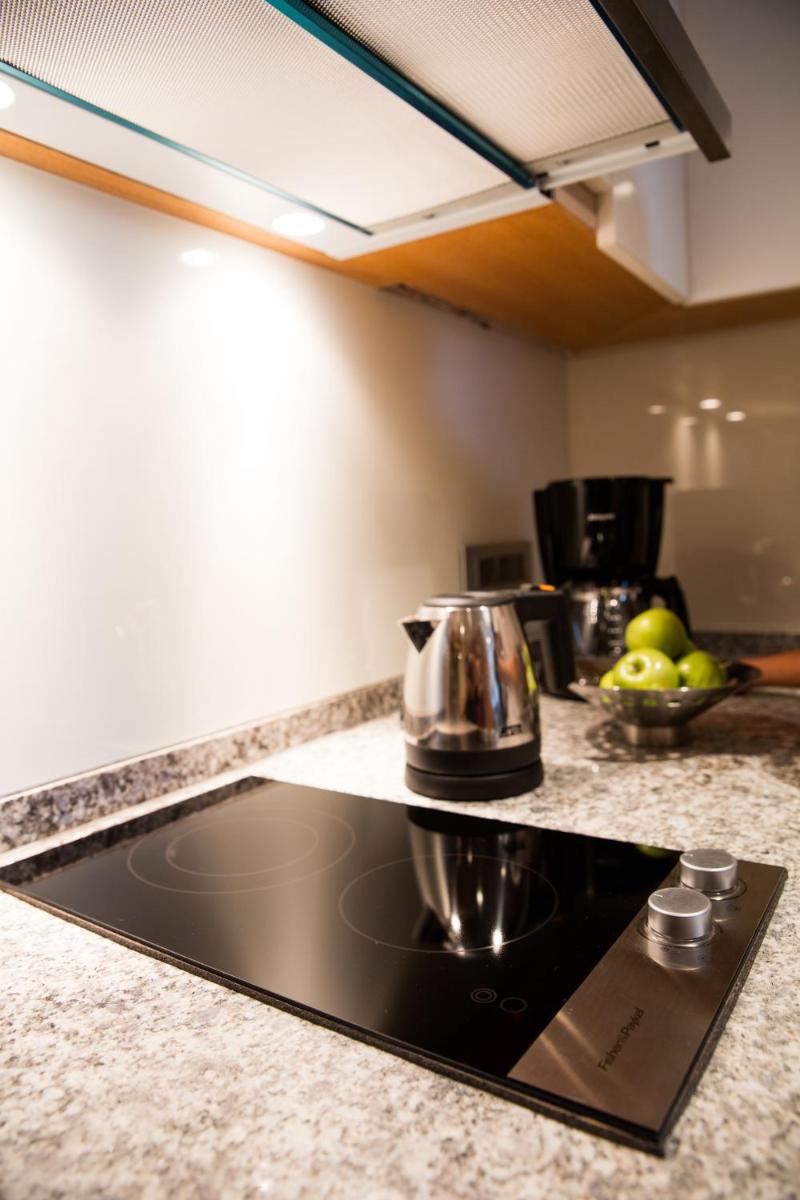 a kitchen with a stove top in a kitchen at Oakwood Residence Kapil Hyderabad in Hyderabad