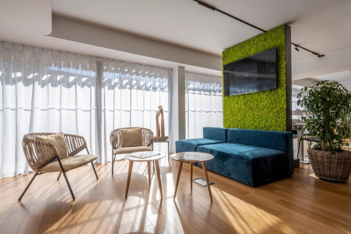 Coin salon dans l'établissement ATHOME RESIDENCE ET SPA