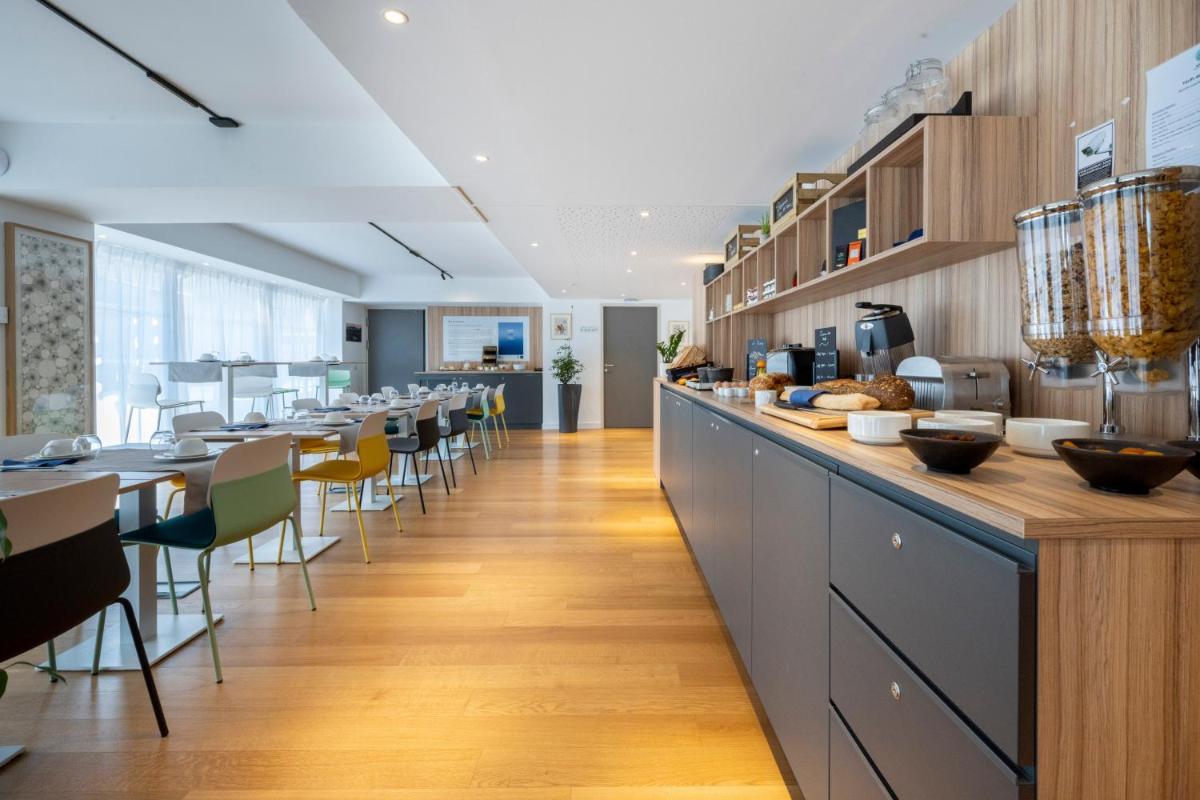 Cuisine ou kitchenette dans l'établissement ATHOME RESIDENCE ET SPA