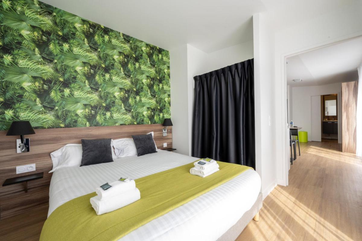 Un ou plusieurs lits dans un hébergement de l'établissement ATHOME RESIDENCE ET SPA
