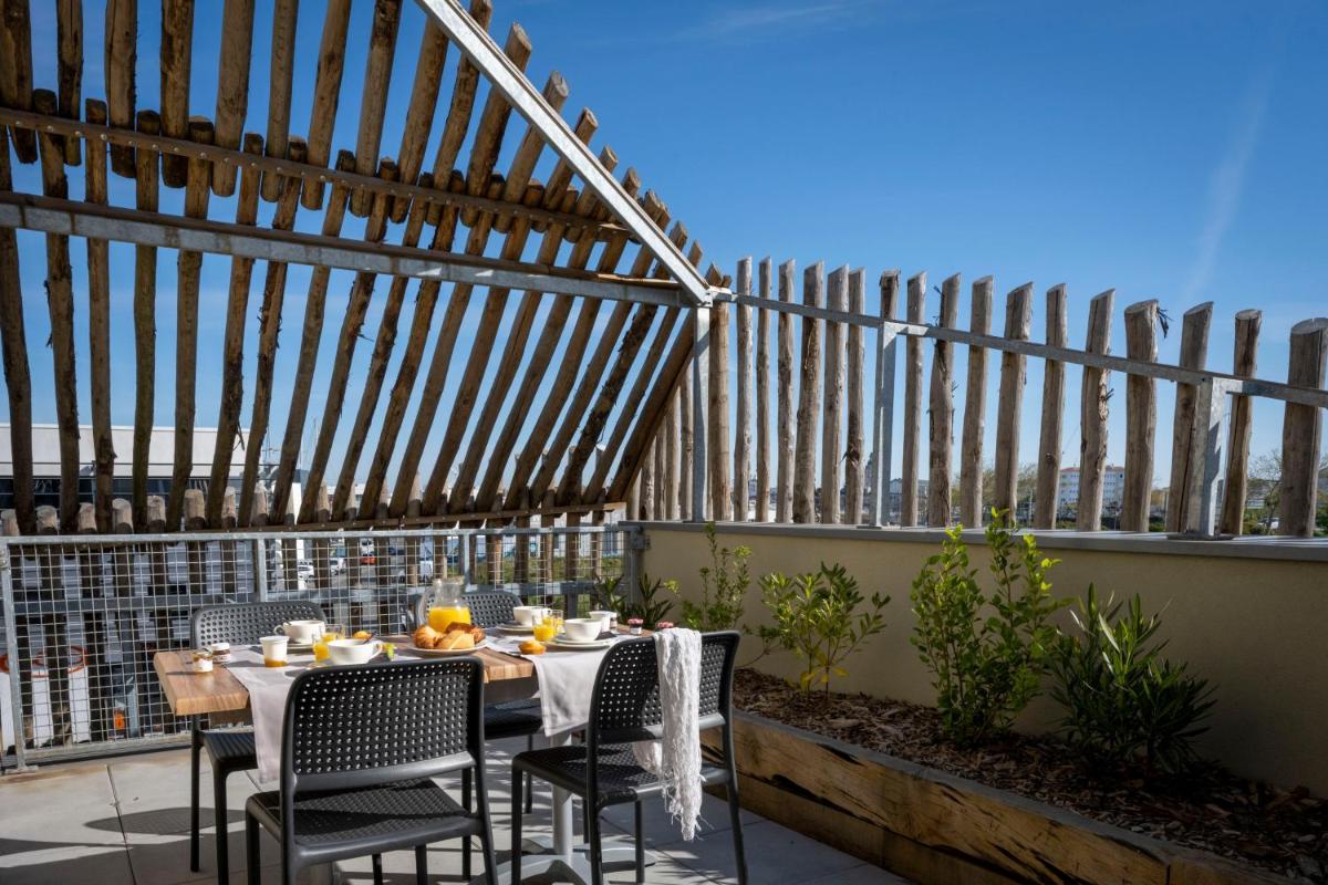Balcon ou terrasse dans l'établissement ATHOME RESIDENCE ET SPA