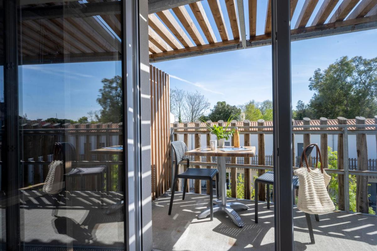 Balcon ou terrasse dans l'établissement ATHOME RESIDENCE ET SPA