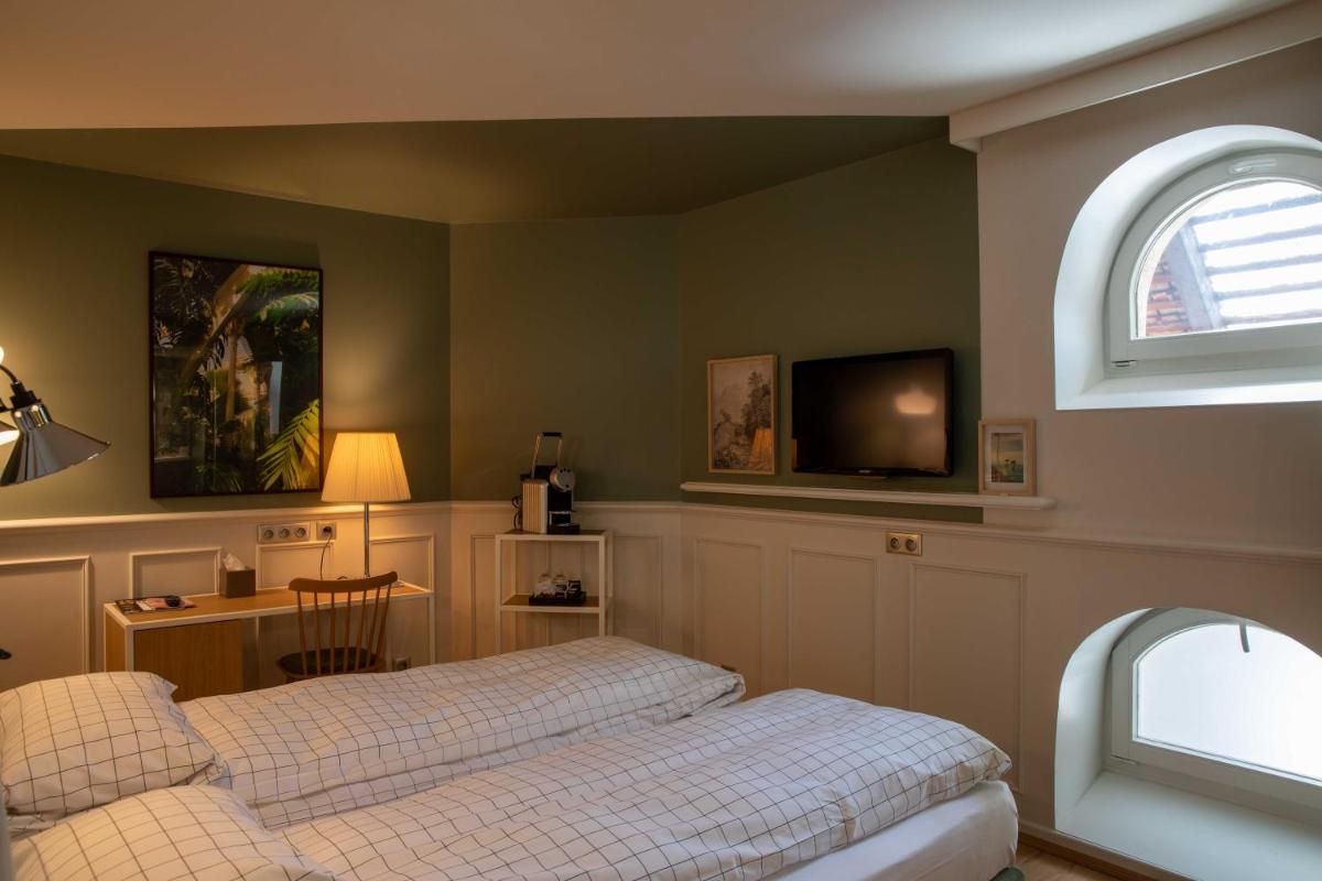 Un ou plusieurs lits dans un hébergement de l'établissement Hôtel et Spa La Villa K - Basel Airport