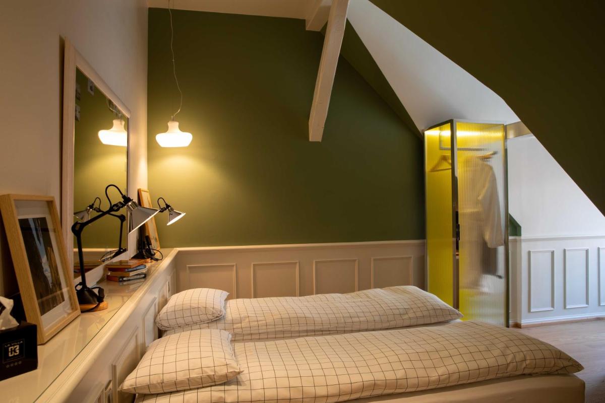 Un ou plusieurs lits dans un hébergement de l'établissement Hôtel et Spa La Villa K - Basel Airport