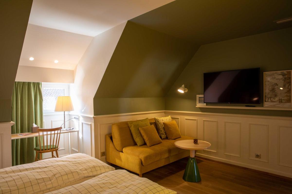 Un ou plusieurs lits dans un hébergement de l'établissement Hôtel et Spa La Villa K - Basel Airport