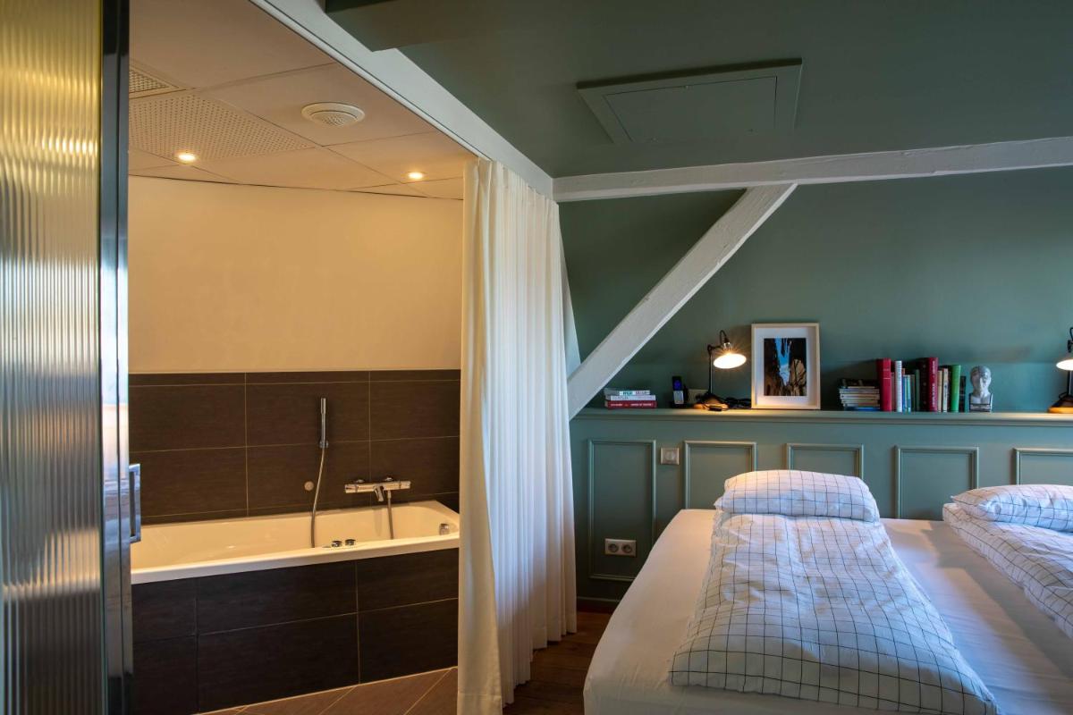 Un ou plusieurs lits dans un hébergement de l'établissement Hôtel et Spa La Villa K - Basel Airport