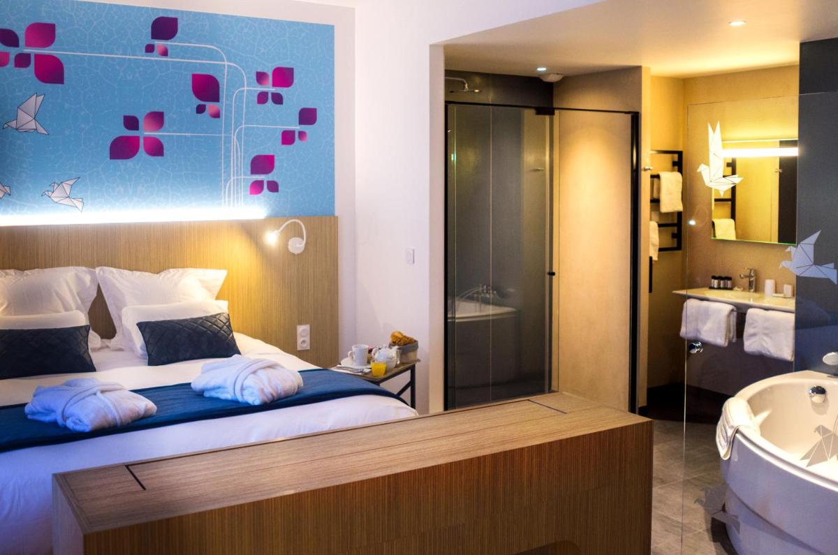 Un ou plusieurs lits dans un hébergement de l'établissement Kyriad Prestige Amiens Poulainville - Hotel and Spa