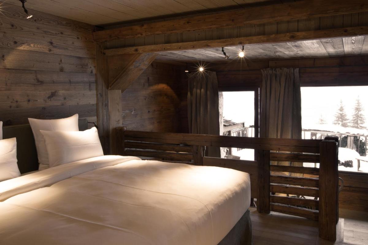 Un ou plusieurs lits dans un hébergement de l'établissement Zannier Le Chalet
