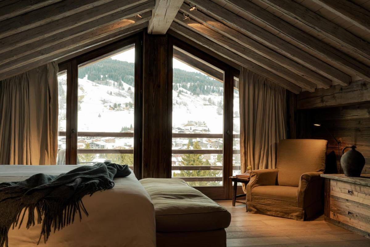 Un ou plusieurs lits dans un hébergement de l'établissement Zannier Le Chalet