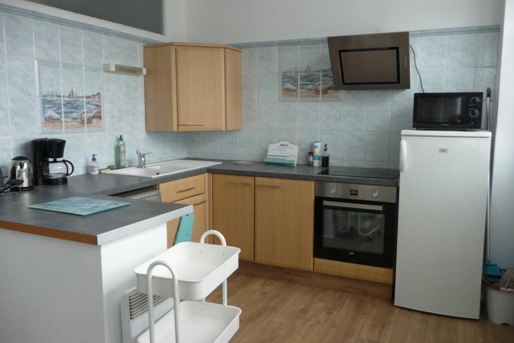 12 RDC Appartement 2 chambres jardin terrasse - Housity