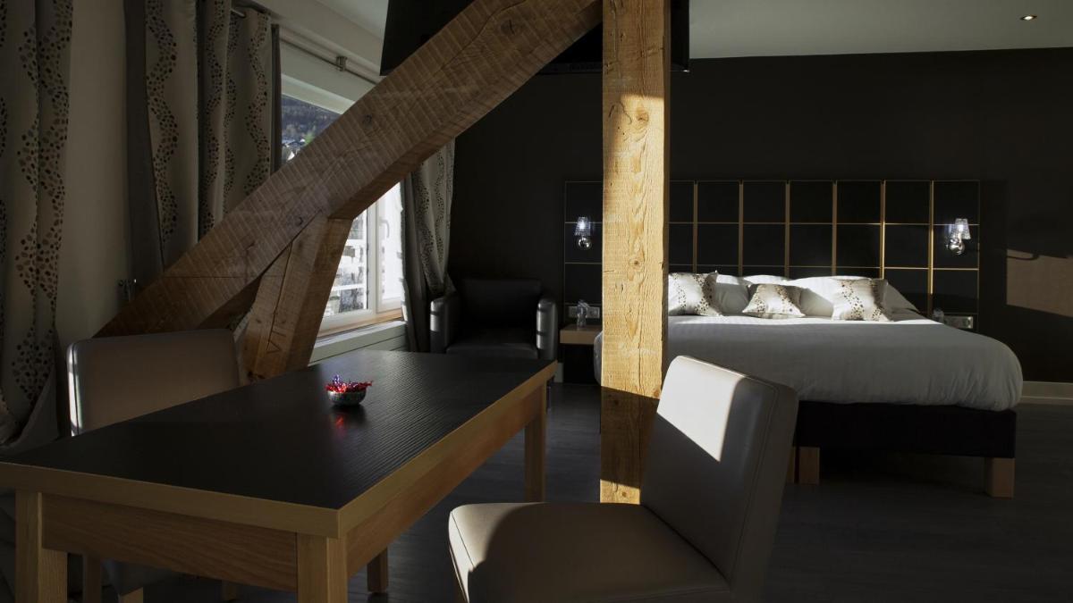 Un ou plusieurs lits dans un hébergement de l'établissement Hôtel Beau Rivage
